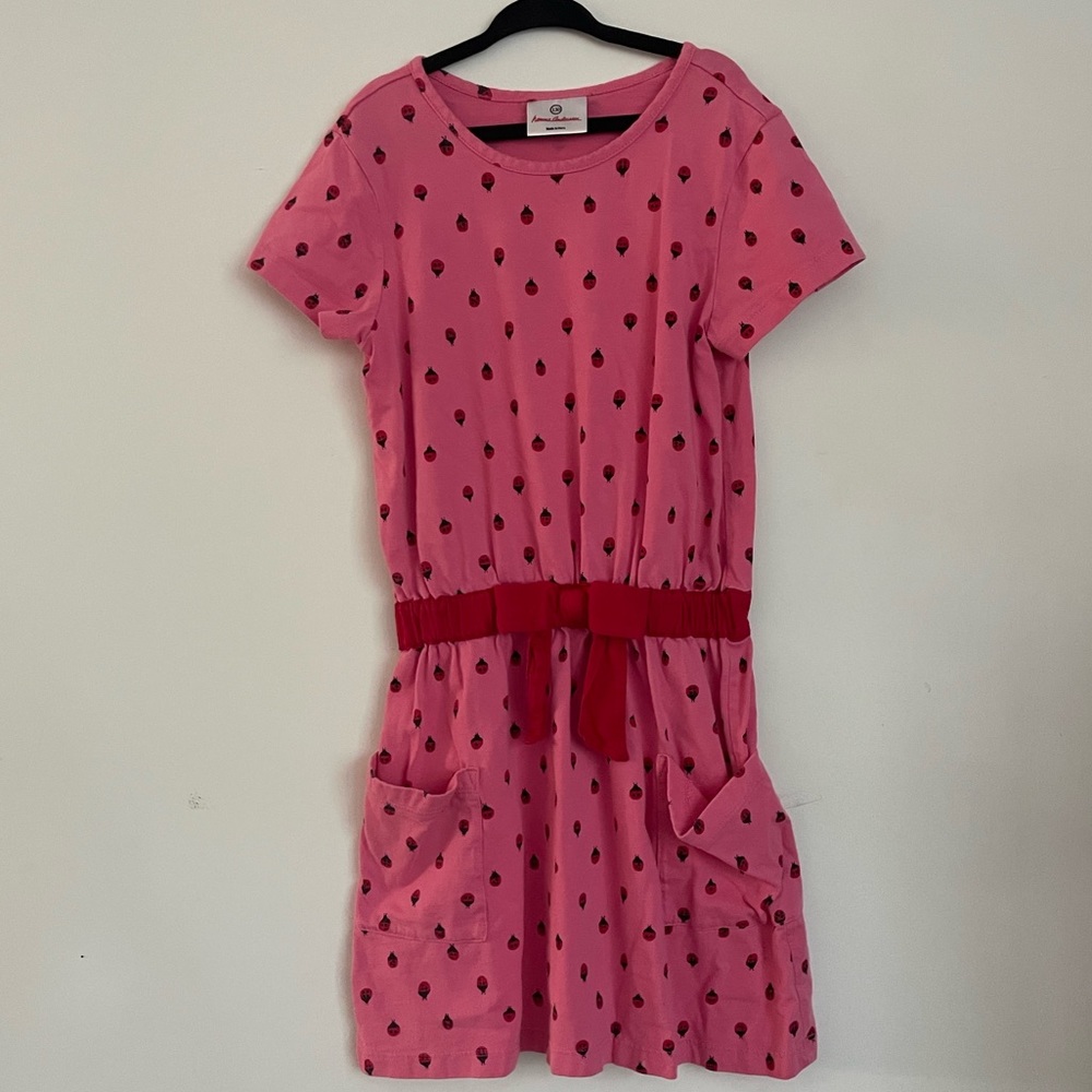 Short sleeve casual ladybug dress with bow and pockets.